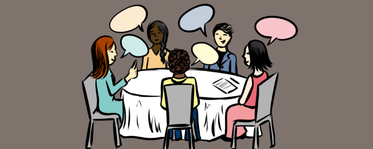 Group of students around table for interview