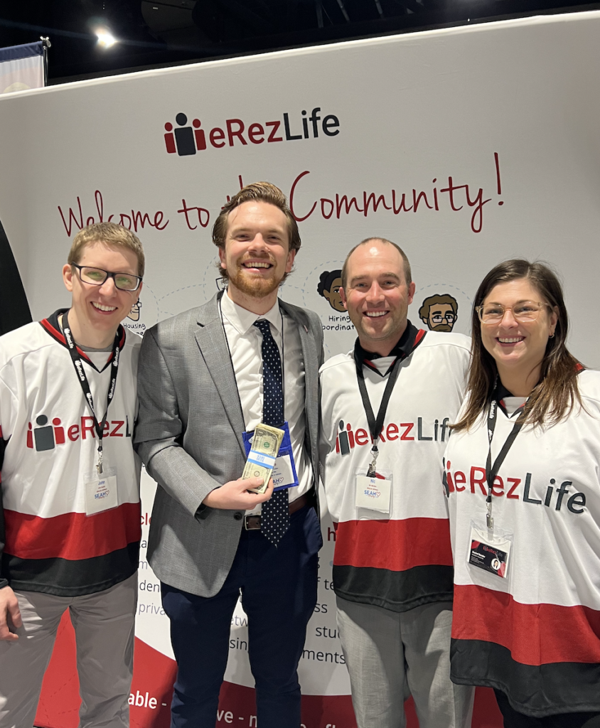 John, Nic, and Rachel at the SEAHO conference with our Shoot to Win winner holding his $100 prize.